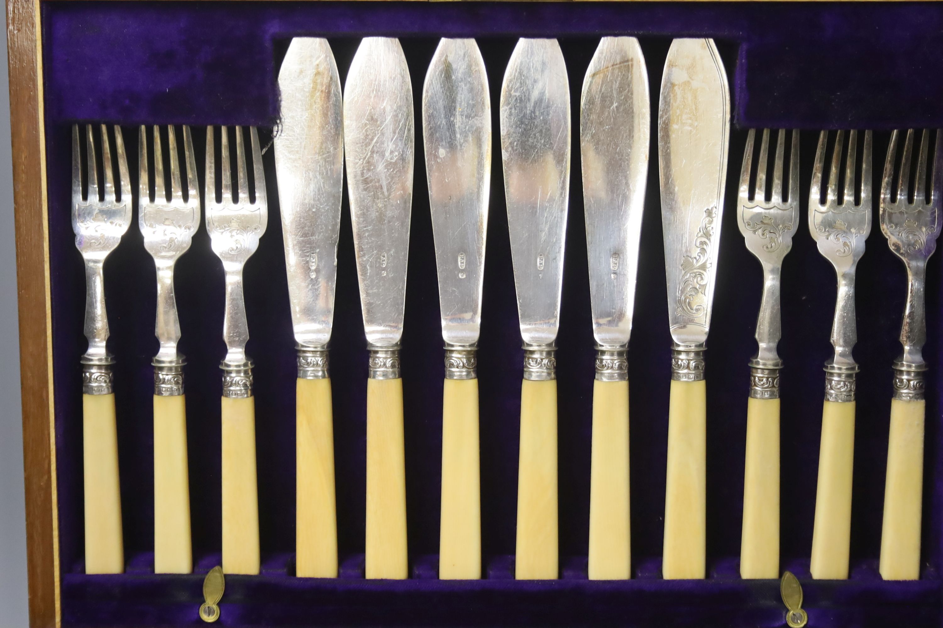 Four cased plated sets